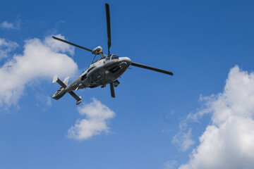 Military dauphin helicopter flying in the air.