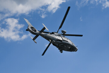 Fototapeta na wymiar Military dauphin helicopter flying in the air.