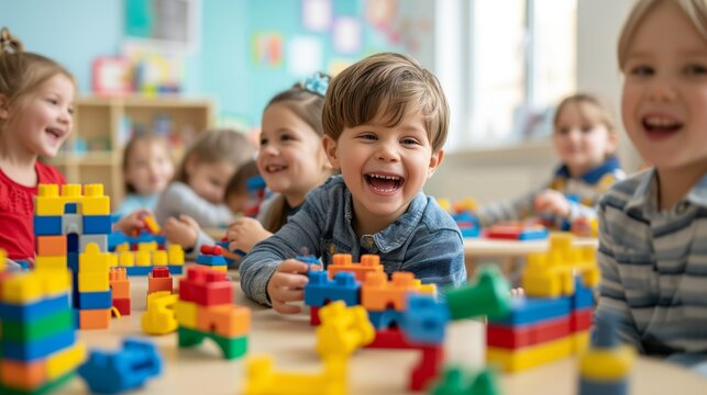 Preschool children play educational toys with cubes in the classroom