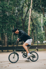 Handsome happy young man with bicycle on a city street, Active lifestyle, people concept