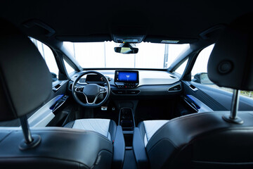 Electric car interior details adjustments. Inside car interior with front seats, driver and...