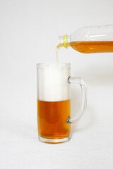 Half a glass of beer,topped up from a plastic bottle.