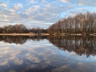 beautiful autumn landscape, river, forest, sky, reflection in water