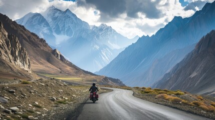 a motorcycle driver cruising along a scenic alpine highway, surrounded by towering peaks and winding roads, showcasing the thrill of adventure amidst breathtaking mountain vistas.