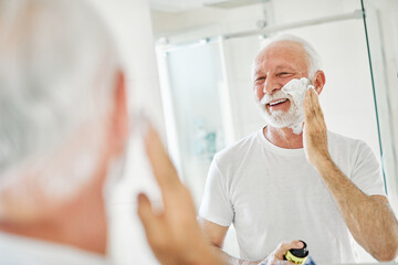 man bathroom shaving senior beard care morning hygiene razor beauty shave skin face hair old mirror skincare elderly routine mature cream grooming foam - obrazy, fototapety, plakaty