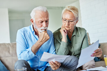 woman man senior bill finance retirement couple home document calculator paper wife  budget elderly...
