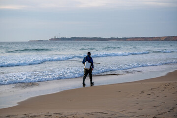 person walking on the beach