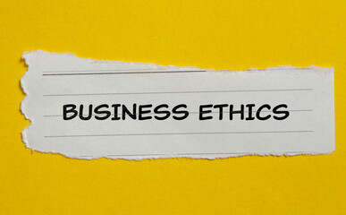Business ethics lettering on ripped paper piece. Conceptual business photo.