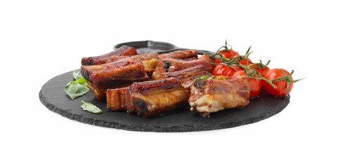 Tasty roasted pork ribs, basil, sauce and tomatoes isolated on white
