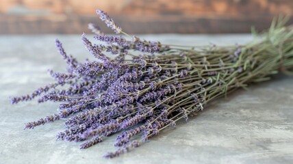 bundle of lavender stems laid upon rustic wood
