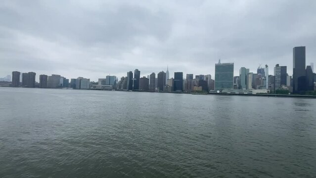 View of the New York skyline from the Long Island pier and observation deck, which is a large island that extends from the east of the Big Apple and Manhattan (USA).