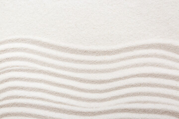 Zen rock garden. Wave pattern on white sand, top view