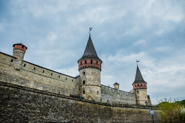 Old Kamianets-Podilskyi Castle under the cloudy sky. Part of the powerful bastions of the castle....