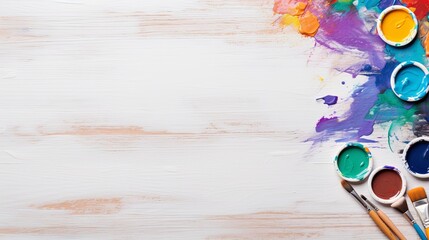 Paint and Brushes on White Wooden Surface. Copy space