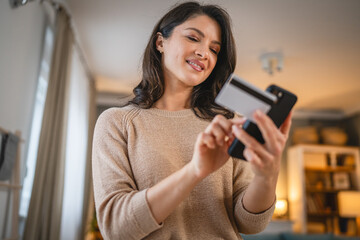 Fototapeta premium woman use credit car shopping online payment or reservation at home