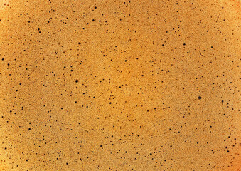 Closeup of espresso coffee foam as background, view from above.