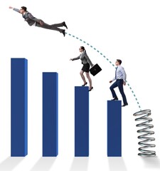 Business people jumping over bar charts