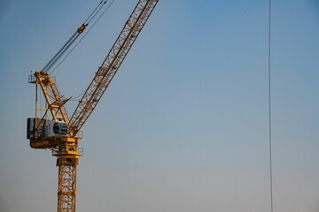 one single construction crane against blue sky
