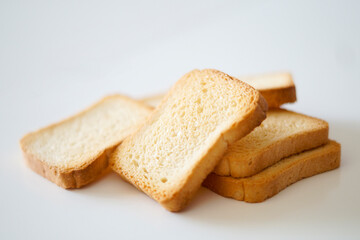Fototapeta na wymiar Close-up view of toasted bread on white background
