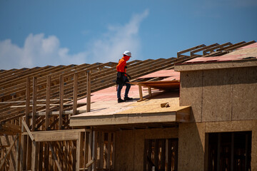 House roof. Roofing construction. Roofer using air nail. Roofing tiles of the new roof under construction building. Repairing building roof. Repair roofs, install roofing, renovate house. Frames roof.