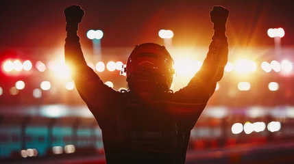 Foto op Canvas Silhouette of race car driver celebrating the win in a race against bright stadium lights. 100 FPS slow motion shot © Orxan