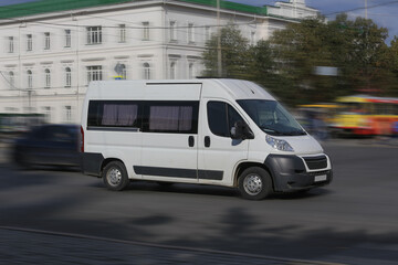 Minibus Goes on the City Street - 725072167