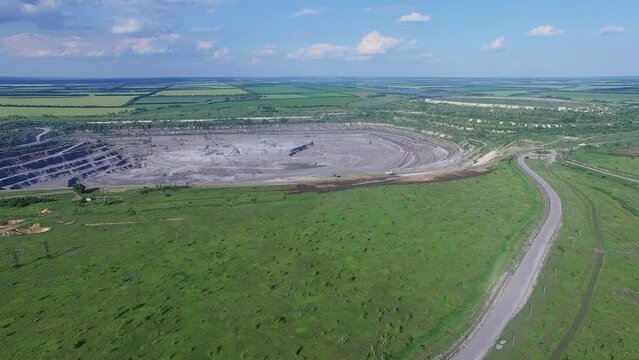 Open-cast mine of granites at sunny summer day. Aerial view