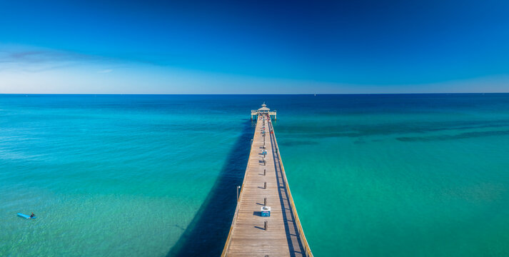 Fototapeta panoramic drone view of pier over ocean
