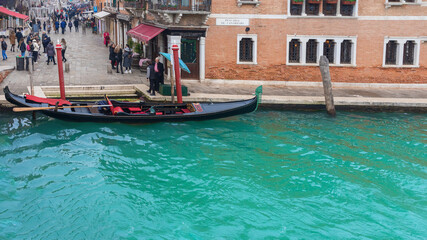 Fototapeta na wymiar A parked gondola on a street in Venice, Italy
