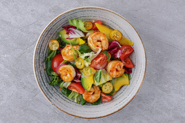 bowl with avocado shrimp and kumquat on stone background, studio food photography 5