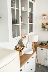 Fototapeta na wymiar White kitchen interior with wooden worktop