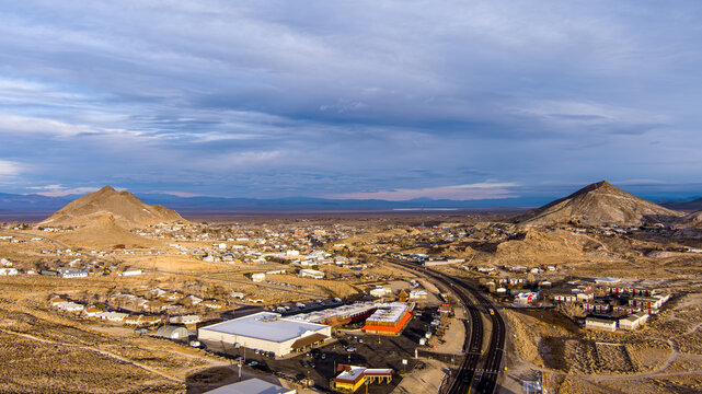 Aerial view of Tonopah Nevada with the downtown district, mining equipment and a large Solar power plant in the background as seen from the south