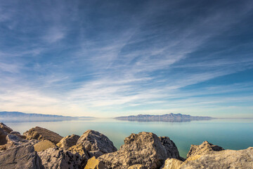 Fototapeta na wymiar Mountains reflected in the Great Salt Lake outside of Salt Lake City, Utah, US.