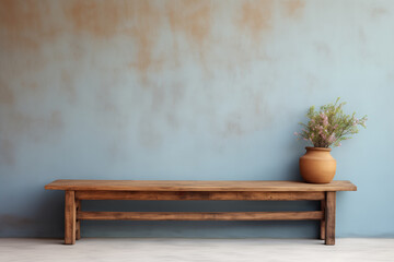 Rustic wood bench against soft blue stucco wall with copy space