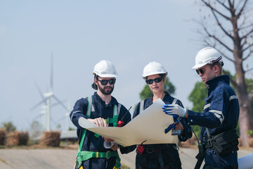 engineers working in fieldwork outdoor. Workers walking and inspect construction and machine around project site. Wind turbine electrical of clean resource enerdy and environment sustainable.