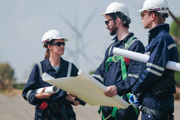 engineers working in fieldwork outdoor. Workers walking and inspect construction and machine around project site. Wind turbine electrical of clean resource enerdy and environment sustainable.