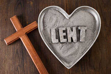 Lent word written in ash, dust as fast and abstinence period concept.