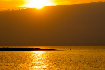 Golden sunset on the sea before the rain probably coming