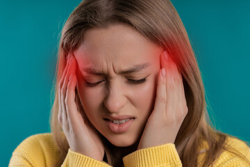 Portrait of beautiful suffering woman having headache, studio portrait. Migraine