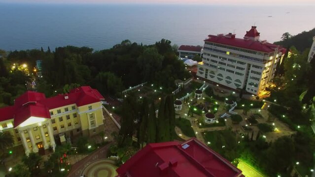 Illuminated territory of sanatorium Truth on Black sea coast at summer evening.