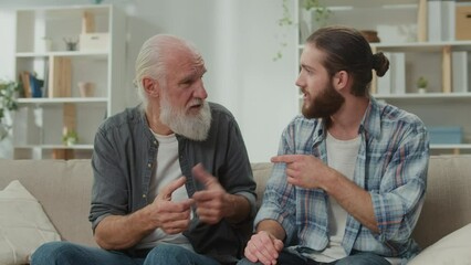 Deep conversation between generations young man and elder on the couch discuss life, experience exchange, heartfelt communication, emotional support, understanding differences mentoring, family values