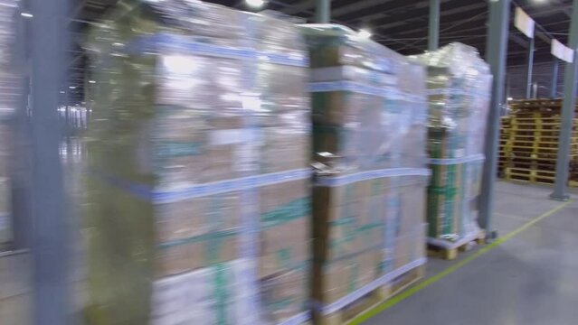 Many stacks with parcels in Ozon company storage hangar
