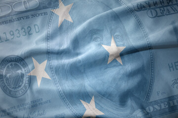 waving colorful flag of Federated States of Micronesia on a american dollar money background....