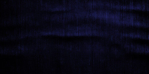 Wide surface of navy blue fabric denim grunge texture. For wallpaper, banner, background design images. Blank copy space Close-up