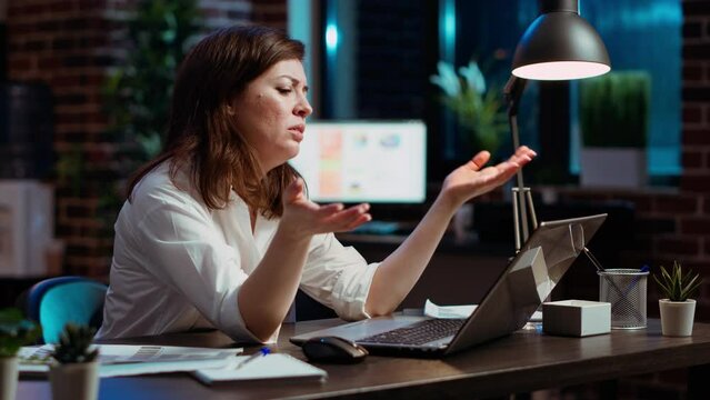Office clerk wincing at laptop screen, unable to believe disappointing negative response received from client while discussing business matters. Worker doing upset face grimace, feeling annoyed