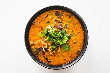 plant-based laksa soup with rice noodles and vegetables