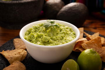 Guacamole. Avocado dip sauce, one of its many ways of consuming it is spread on tortilla chips also called Nachos. Mexican easy homemade sauce recipe very popular.