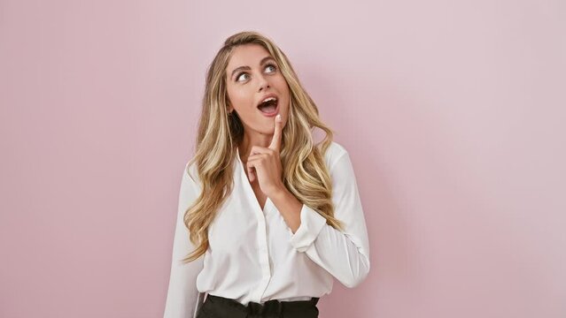 Oops! young, attractive blonde woman in despair, hand over head realizing an error. standing clueless, wearing a shirt, against isolated pink background, regretting a mindless mistake.