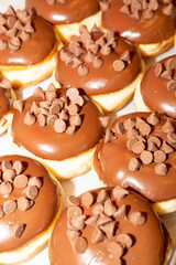 Closeup of doughnuts in a tray.