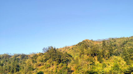 View of water flowing in the river near the hill